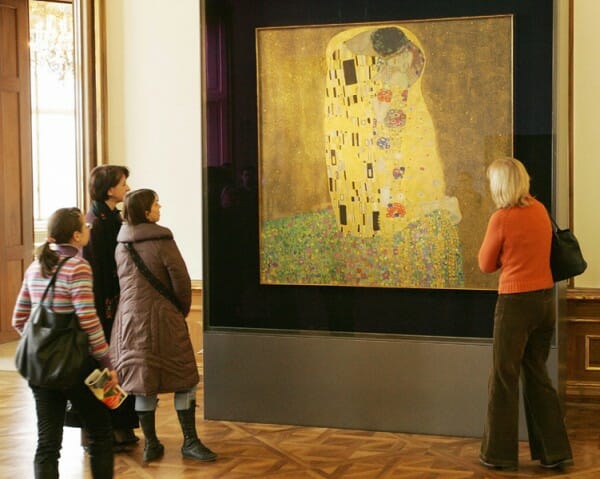 Visitors stand in front of Gustav Klimt´s painting 'Der Kuss' (The Kiss) at the Belvedere Museum in Vienna.